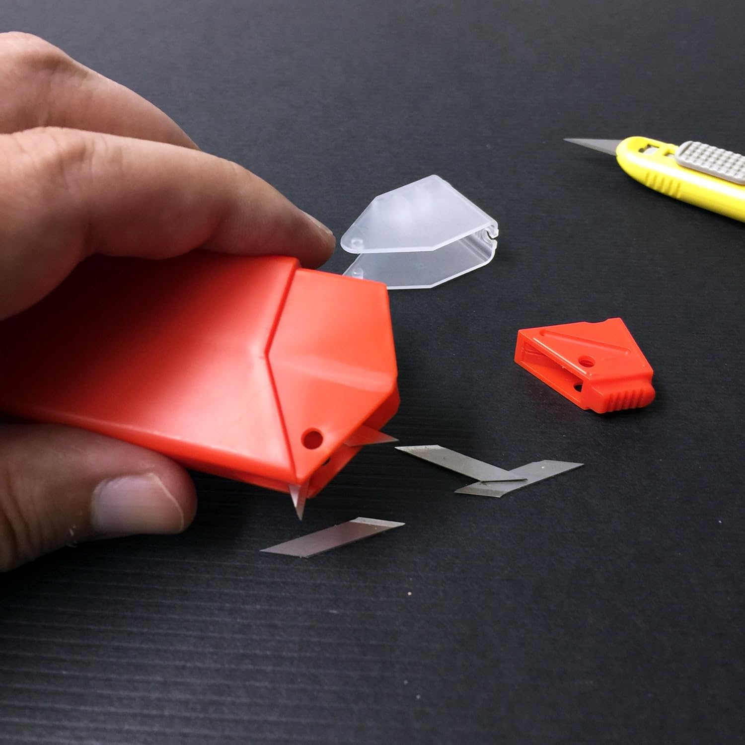 NT Cutter 9mm Snap-Off Precision Blade in use, showcasing its sharpness and precision.