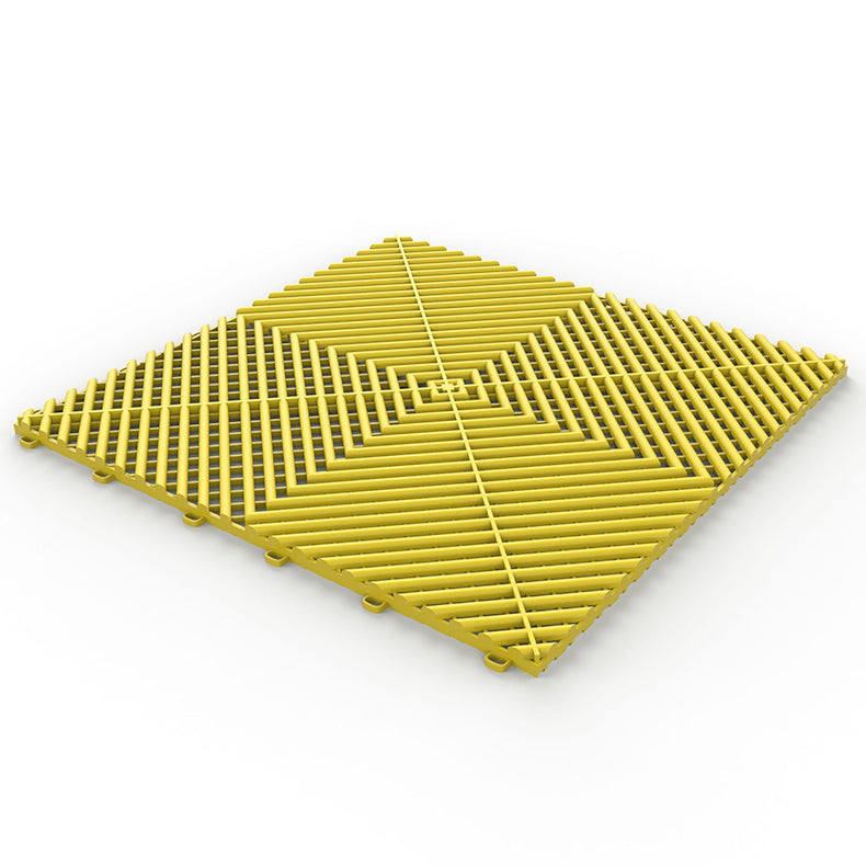 yellow GaraZilla durable garage tiles, brightening up the garage area.