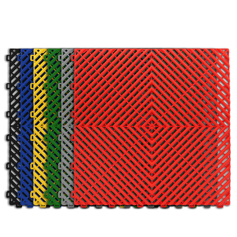 Assortment of GaraZilla garage flooring tiles in blue, red, green, yellow, gray, and black, showcasing the variety and versatility of the product.