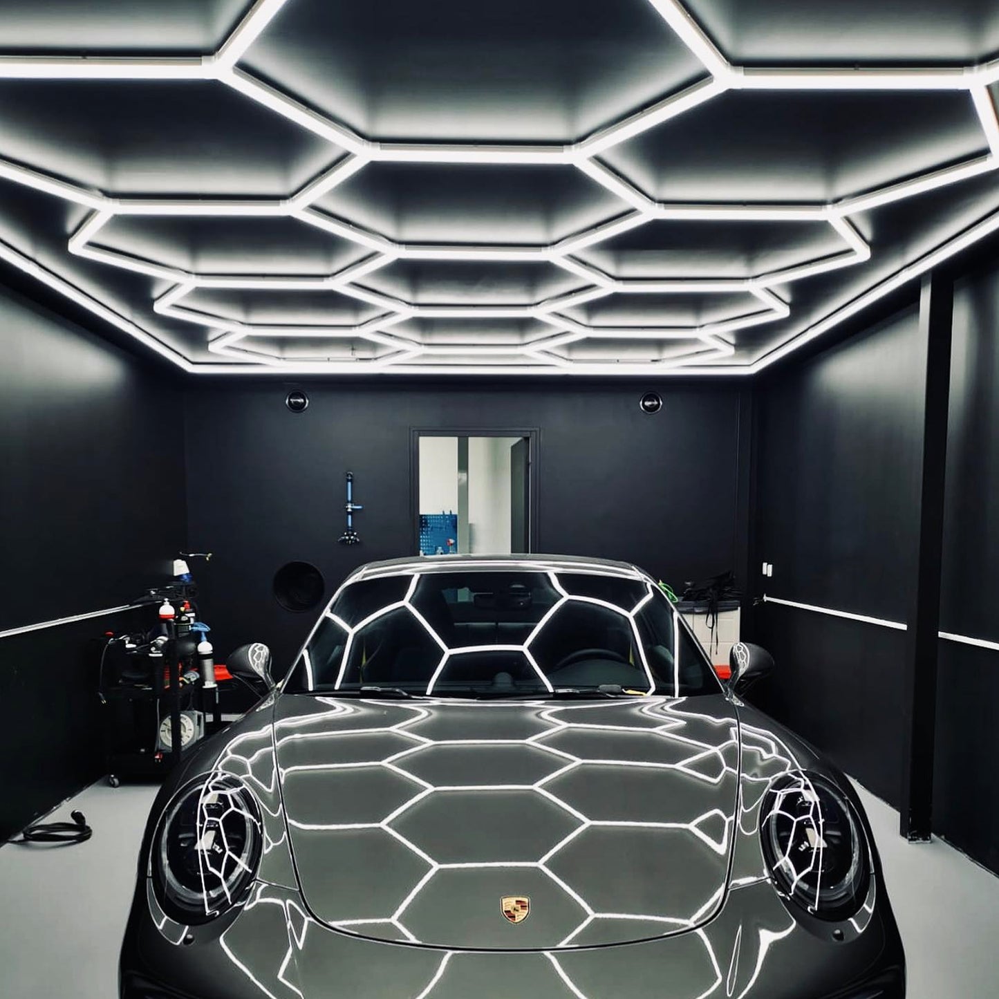 Detailed view of the Vortex Hexa LED Light ST1028 installation in a contemporary garage setting.
