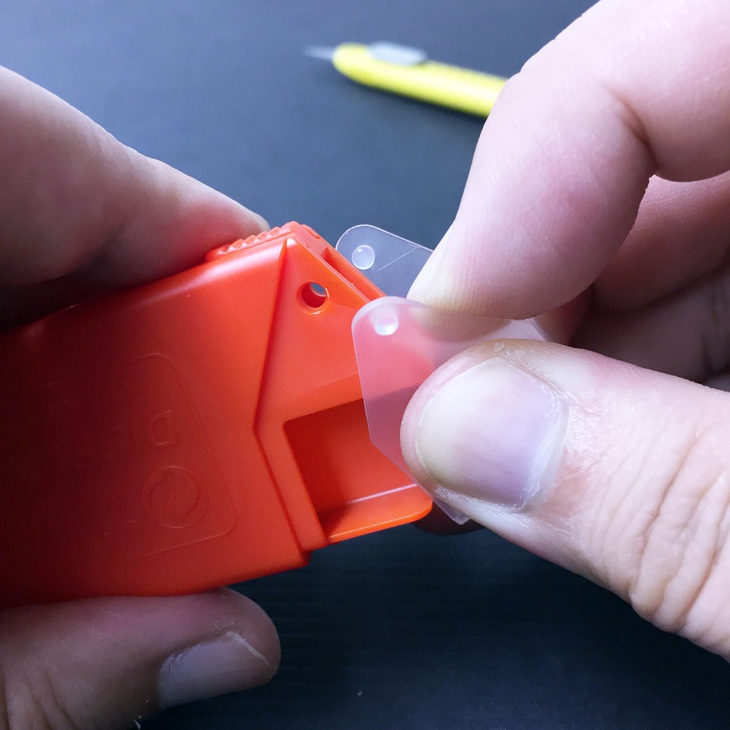 Various materials being precisely cut with NT Cutter 9mm Blades, emphasizing versatility.