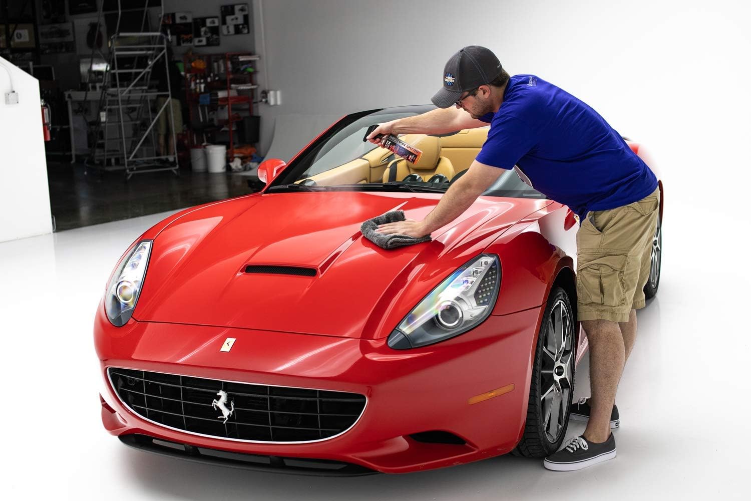 Detailer applying P&S Bead Maker Paint Protectant, demonstrating the product's compatibility with both wet and dry surfaces.