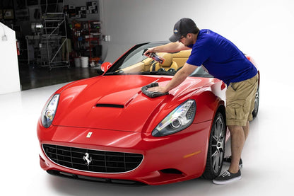 Detailer applying P&S Bead Maker Paint Protectant, demonstrating the product's compatibility with both wet and dry surfaces.