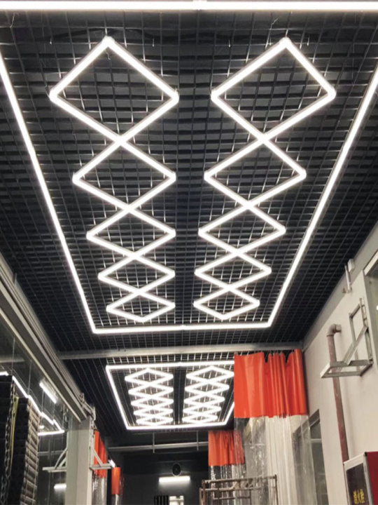 Advanced LED technology of the Vortex Hexa Light ST2018 illuminating a workspace in the garage.